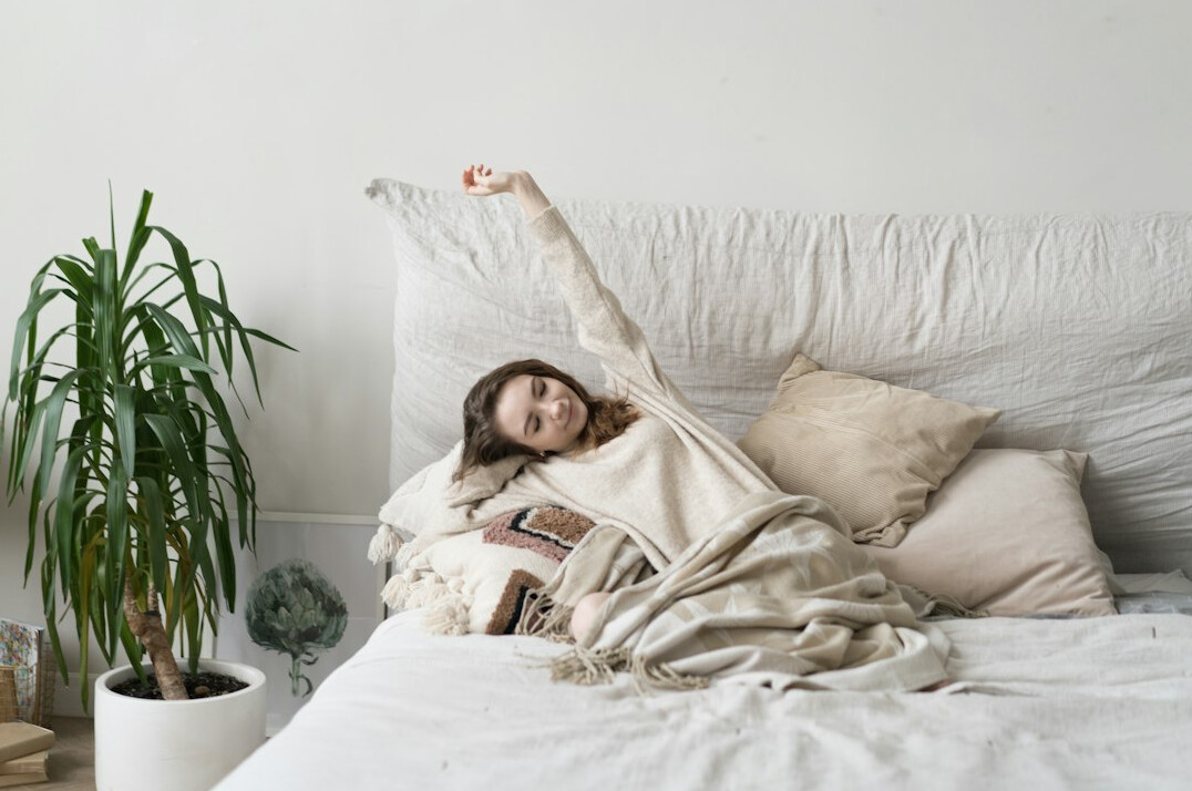 person sleeping in cozy bed