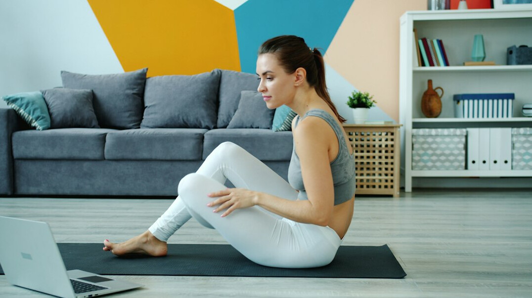beginner doing squats at home