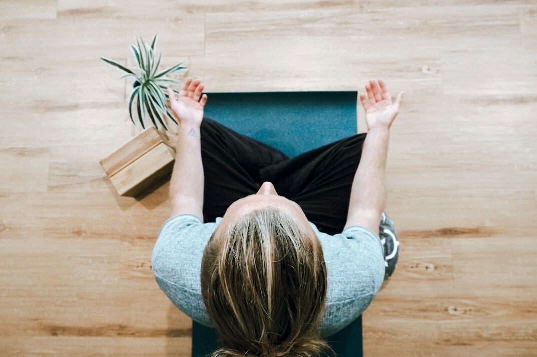 person practicing deep breathing exercises