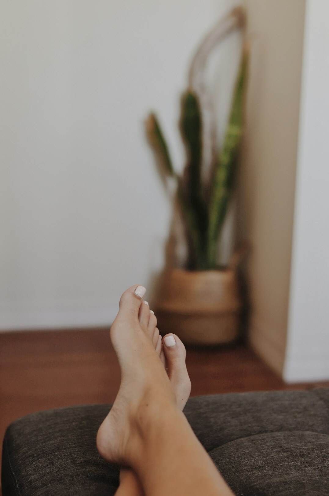 Woman doing yoga stretch in a bright room